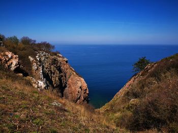 Scenic view of sea against blue sky