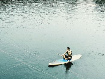 High angle view of man sitting in boat