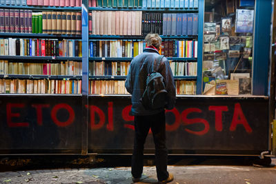 Full length of man standing on book
