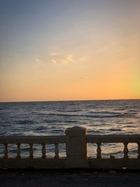 Scenic view of sea against clear sky during sunset