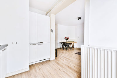 Empty chairs and table against wall at home