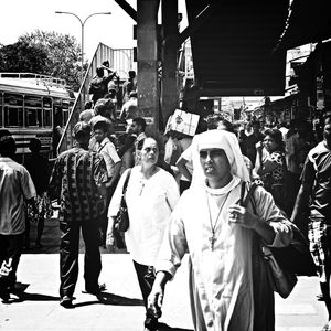 People looking at city street