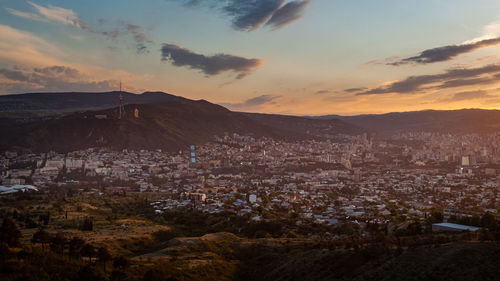 High angle view of townscape against sky at sunset