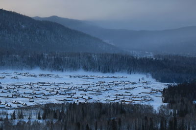 Scenic view of frozen lake against sky