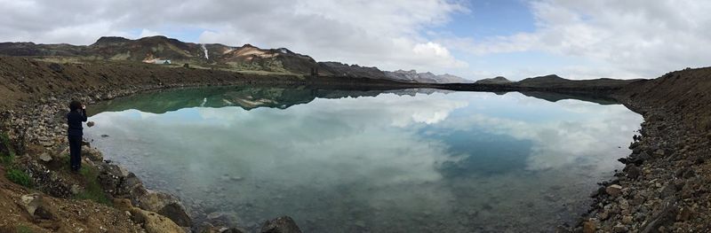 Scenic view of lake against cloudy sky