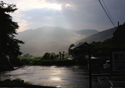 Scenic view of mountains and river against sky