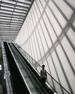 Person standing on escalator