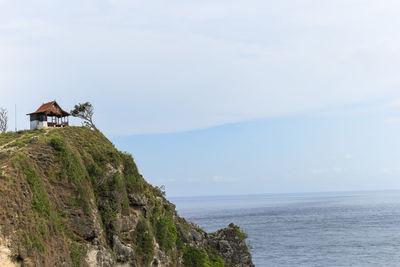 Scenic view of sea and buildings against sky