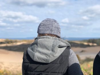 Rear view of person standing on land