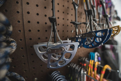 Close-up of climbing equipment hanging at store