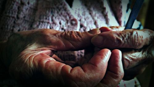 Close-up of man holding hands