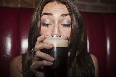 Young woman enjoying a drink