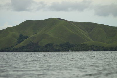 Scenic view of bay against sky