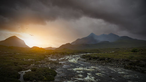 Scenic view of mountains against sky during sunset