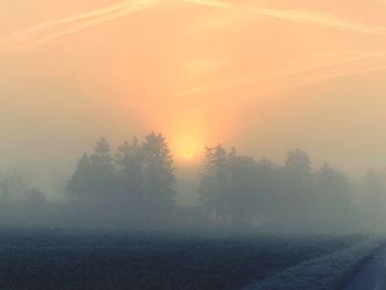 Scenic view of landscape against sky during sunset