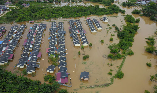 River overflows flood a residential area, in pekanbaru city, riau province, indonesia.