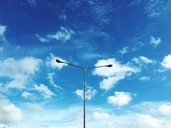 Low angle view of street light against sky