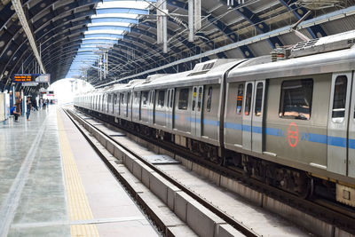 Delhi metro train arriving at jhandewalan metro station in new delhi, india, asia, public metro rail