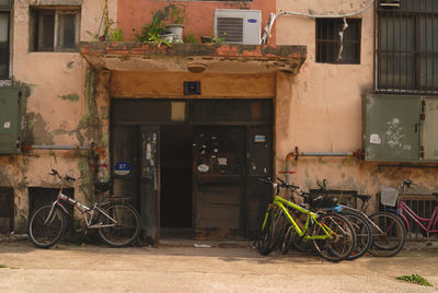 Bicycles parked against building