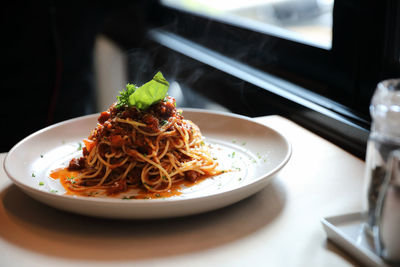 Close-up of noodles in plate on table