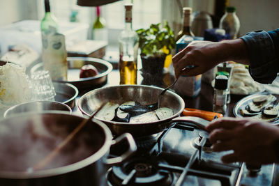 Close-up of man working in kitchen