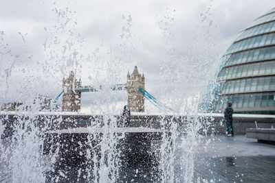 Spraying water against tower bridge