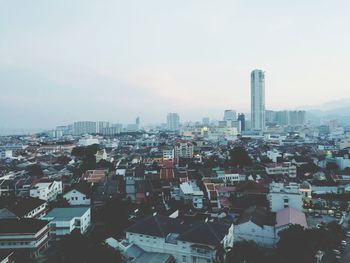 High angle view of city buildings against sky