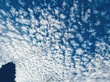 Low angle view of vapor trails in sky