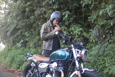 Man riding motorcycle on road