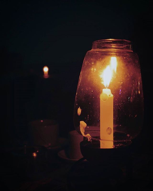 flame, burning, candle, illuminated, fire - natural phenomenon, glowing, lit, indoors, heat - temperature, candlelight, close-up, darkroom, night, dark, black background, lighting equipment, tea light, studio shot, still life, copy space