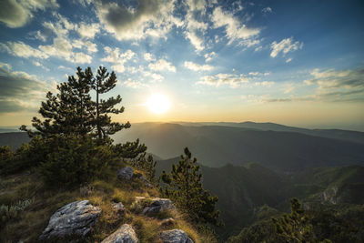 Scenic view of mountains against sky during sunset