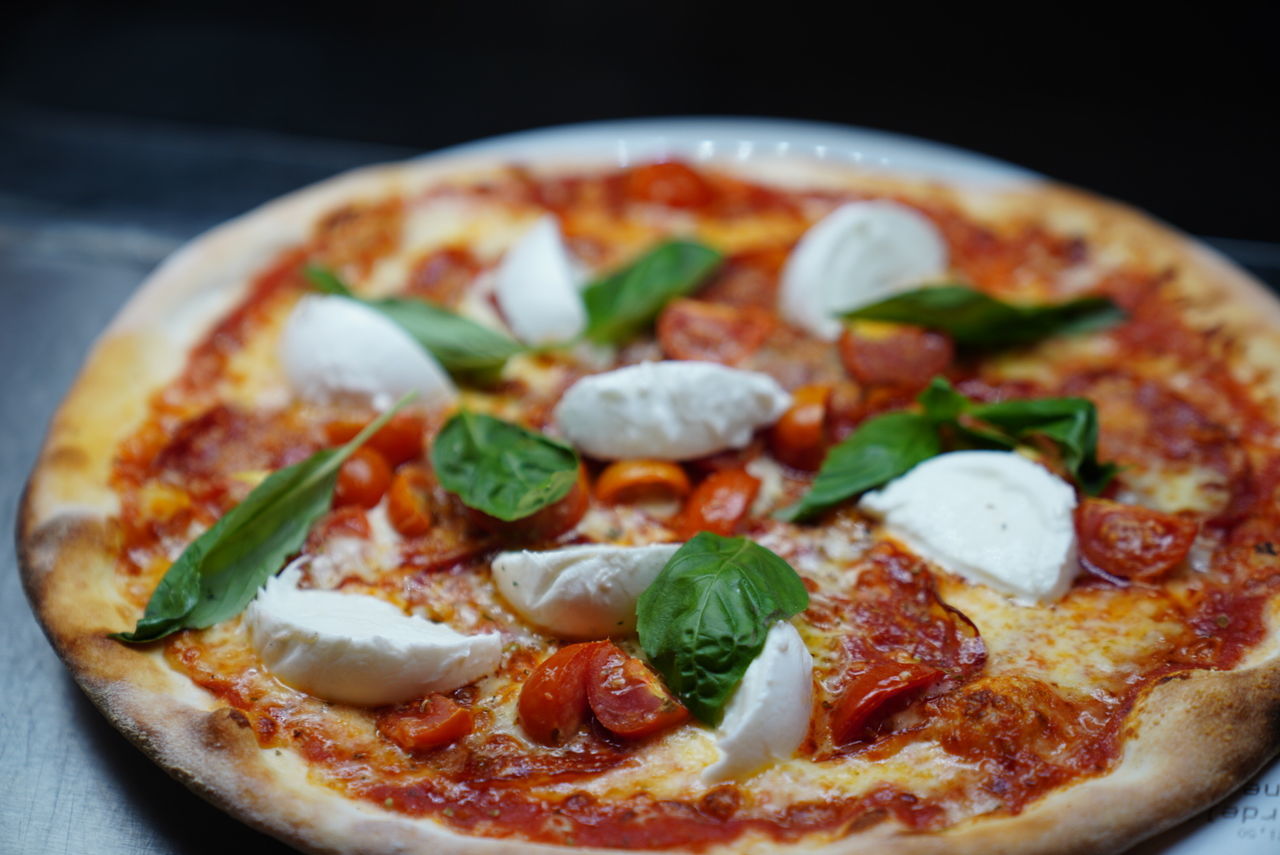 CLOSE-UP OF PIZZA SERVED IN PLATE