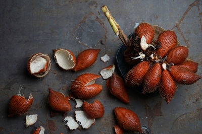 Directly above of snake fruits on table