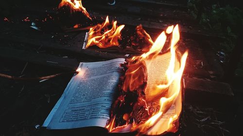 High angle view of book burning on field