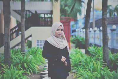 Young woman standing outdoors