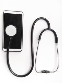High angle view of smart phone against white background
