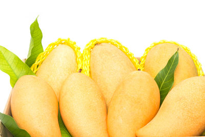 Close-up of fruits against white background