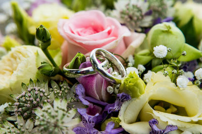 Wedding rings center in wedding bouquet