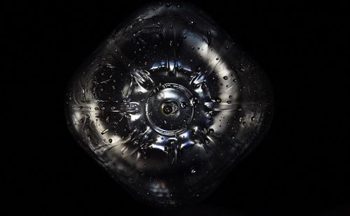 Close-up of electric lamp against black background