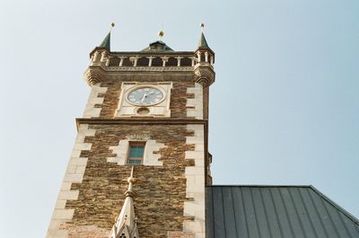 Low angle view of clock tower against sky