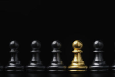 Close-up of chess pieces against blurred background