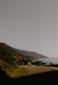 Scenic view on california big sur coast of camper vehicle parked on coast