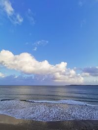 Scenic view of sea against blue sky