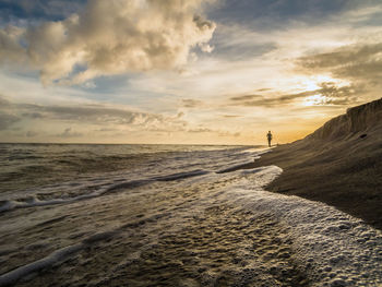 Scenic view of sea against sky at sunset