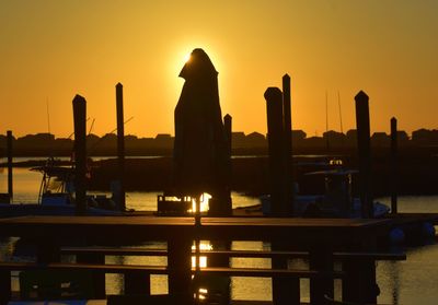 Silhouette of swimming pool at sunset