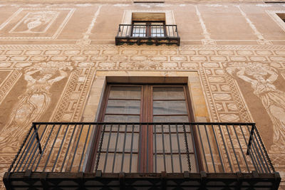 Detail of an ancient palace balcony in the gothic neighborhood of barcelona, spain.