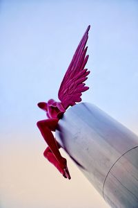 Close-up of red flower against sky