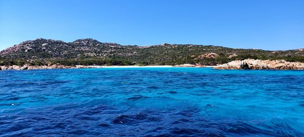 Scenic view of sea against clear blue sky