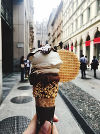 Hand holding ice cream cone