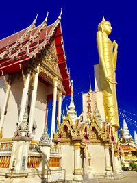 Exterior of temple against clear blue sky